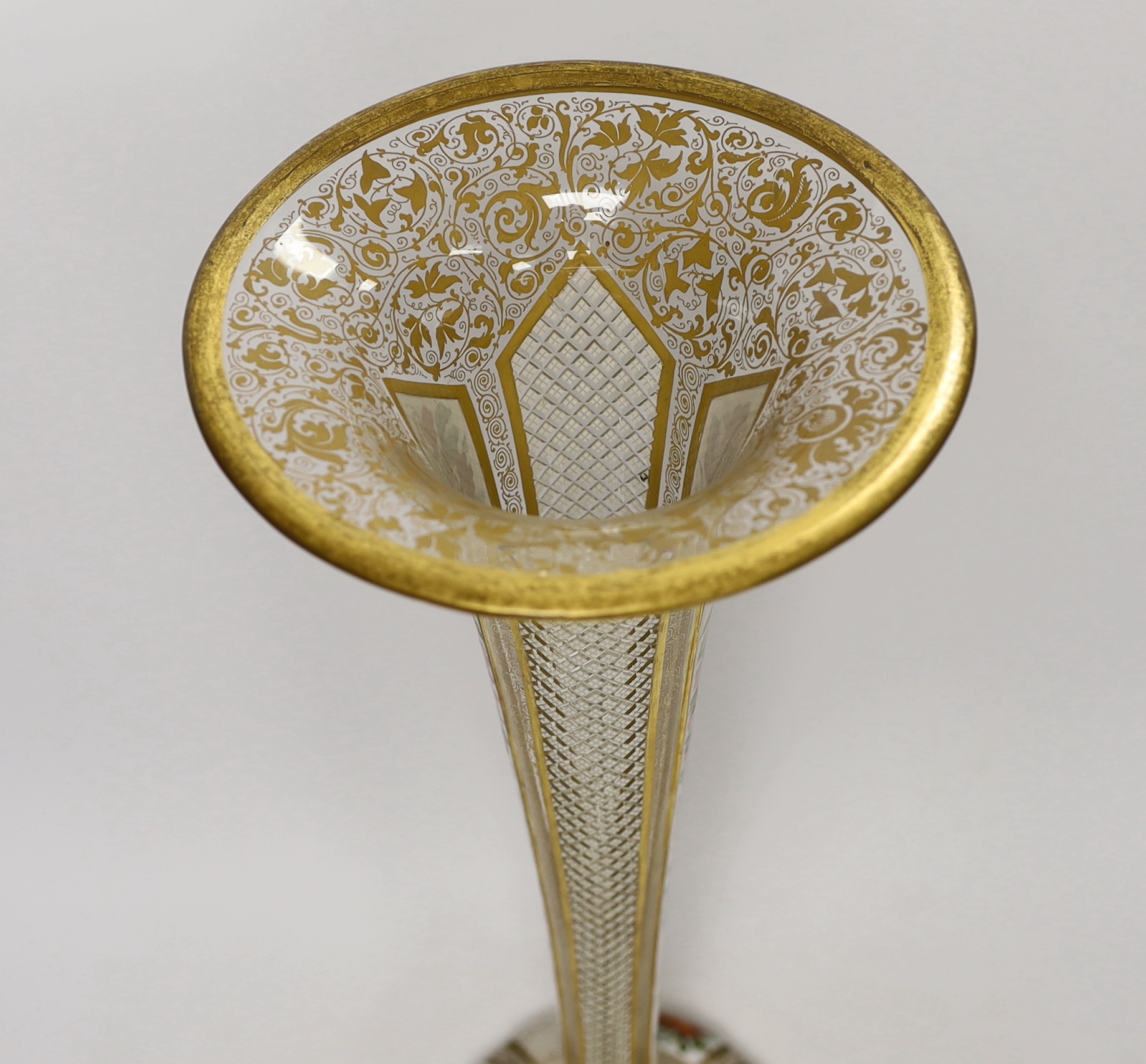 A large late 19th century Bohemian gilt and enamelled glass trumpet shaped vase, 50cm